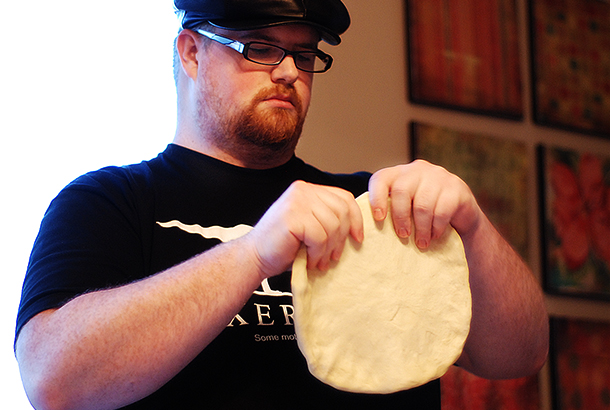 Troy kneading the dough.