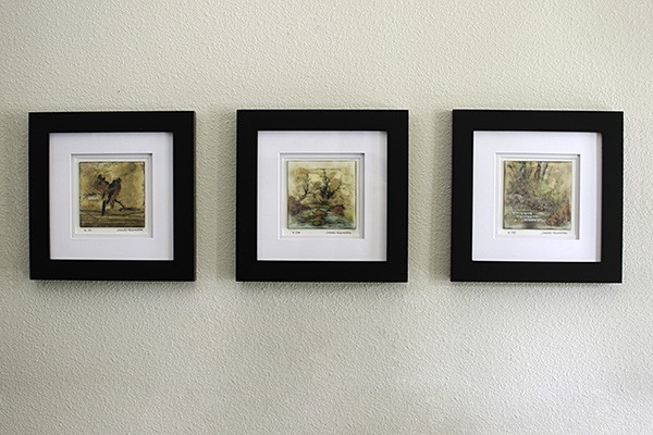 a grid display of mini encaustic paintings